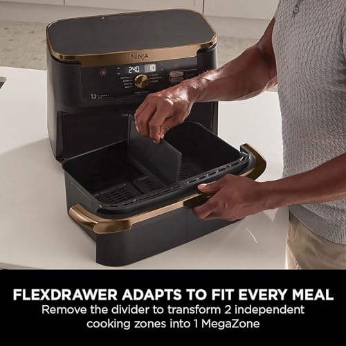 Ninja kitchen appliance with flexdrawer feature being used by a person.