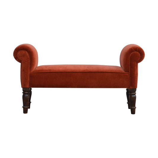 Red velvet bench with wooden legs on a white background
