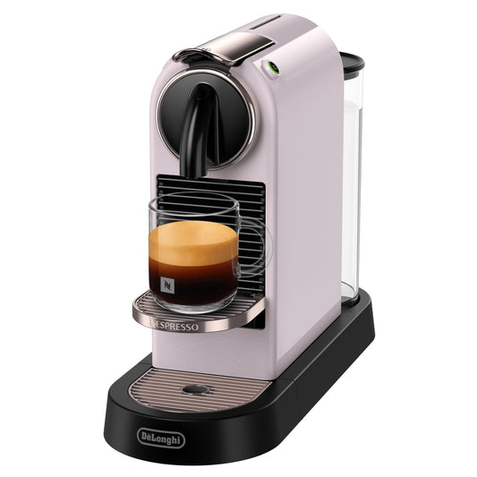 Nespresso coffee machine with a glass holder containing a capsule of coffee on a white background